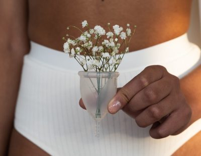 woman-in-white-undergarments-holding-menstrual-cup-with-3737819